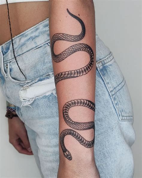 snake wrapped around arm tattoo|Snake wrapped around arm tattoo